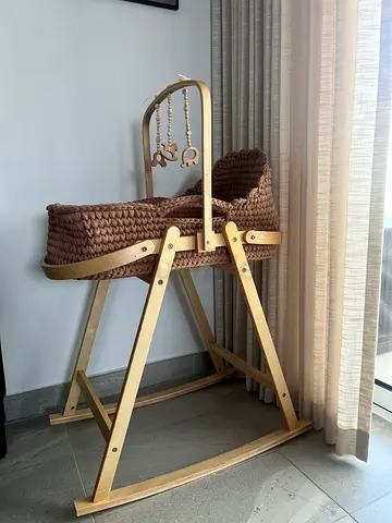 Handmade knitted Moses basket with wooden foldable stand