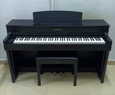 The Yamaha Clavinova CLP-645B is a high-quality 88-key digital piano in a matte black finish,