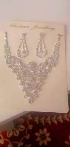 Silver-tone crystal necklace and matching drop earrings set