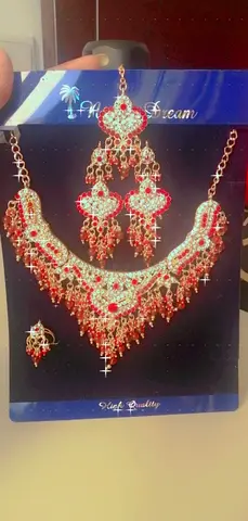 Red and gold bridal-style necklace set with matching earrings