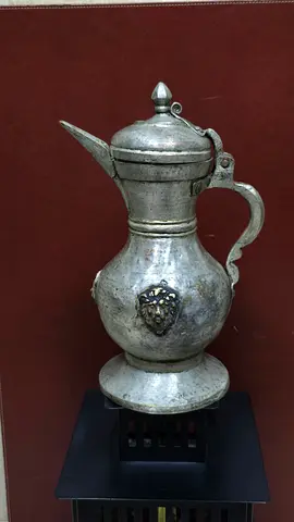 Antique red copper pitcher