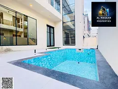 A modern villa in the Al-Sa'ada development in Al-Yasmeen, featuring a swimming pool, a private roof