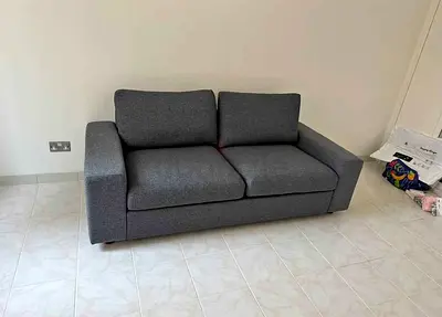2-seater grey fabric sofa bed  in good condition vimle