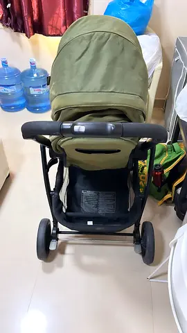 Used olive green baby stroller - compact, good condition