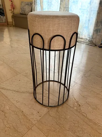 Metal frame stool with beige cushioned seat - compact side stool