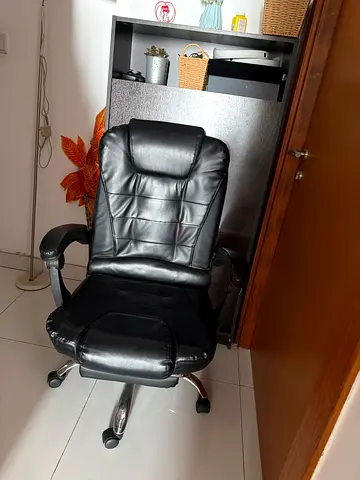 Black leather ergonomic office chair with footrest - good condition