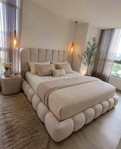 Modern upholstered queen bed with scalloped frame and headboard - beige