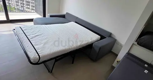 Grey L-shaped Sofa Bed with Mattress - Good Condition