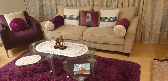 Beige 3-seater Sofa with Purple Accent Cushions and Armchair