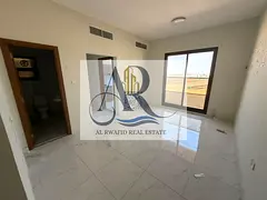 Al Rawda Apartment with Built-In Wardrobes, Balcony and Central AC