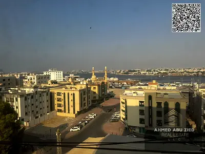 1BR apartment for annual rent in Rashidiya 2 Ajman, direct sea view on Ajman creek, 2 baths, balcony, ideal for families & employees, 30k in 4 payment