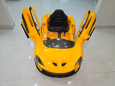 Yellow electric ride-on sports car for kids with gull-wing doors