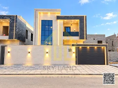 Villa for sale in Al Helio, Ajman. Features 4 master bedrooms, a majlis, two living areas, and a maid’s room. Available for freehold ownership by all