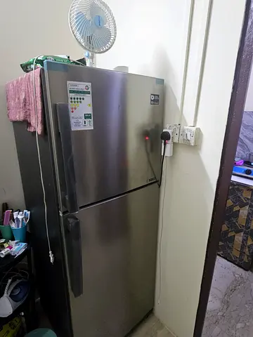 Silver double-door refrigerator, good working condition