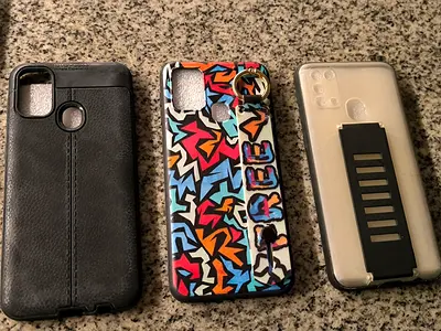 Samsung M 31 Set of 3 used phone cases with kickstand and ring holder.