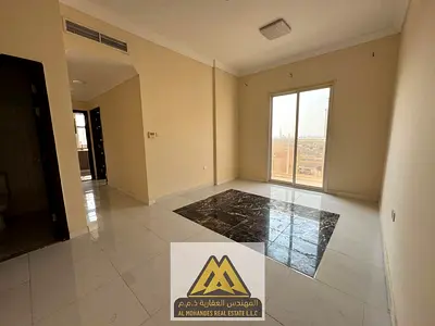 Annual rent in Al Alia, Ajman: spacious 1-bedroom apartment, 2 bathrooms, central AC and balcony. AED 30,000, payable in 4 or 6 installments.