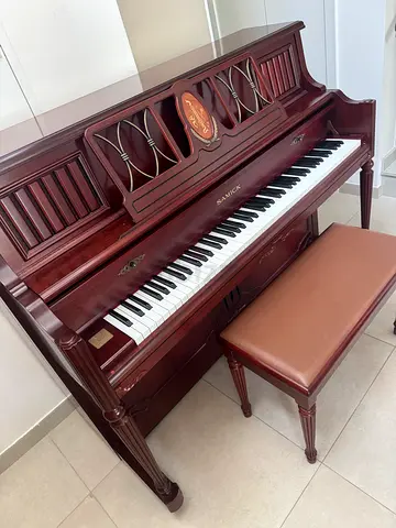 vintage upright console acoustic piano made by Samick with chair