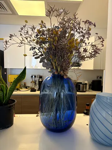 H&M Home blue glass vase with dried flowers