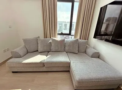 Light grey L-shaped sectional sofa (3-seater + chaise) - good condition