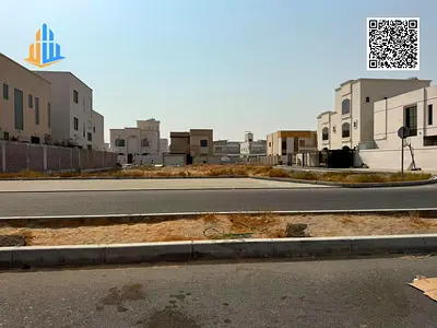 Residential corner plot for sale in Al Alia, Ajman | 4,306 sq. ft. | G+2 building permit | Freehold | AED 1.48 million