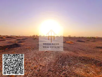 Own land including registration fees in AL Manamh 8,Ajman ,loc is distinguished by mountians and valleys,climate.tranguility