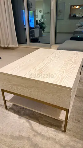 Light wood coffee table with storage and brass legs - good condition