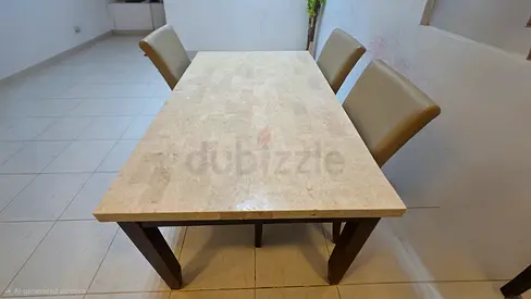 Solid stone top dining table with 3 leather chairs - negotiable