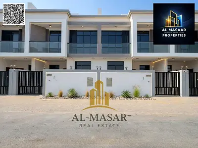 Townhouse in Al Bahia, Ajman, featuring 6 master bedrooms, two floors, and a roof terrace. Availabl