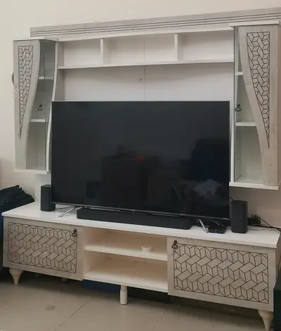 TV stand - White wooden entertainment TV unit with storage cabinets and shelves