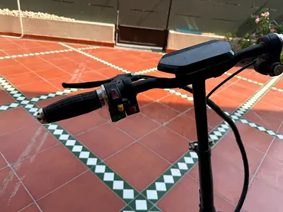 Used electric scooter — compact handlebars with display and controls