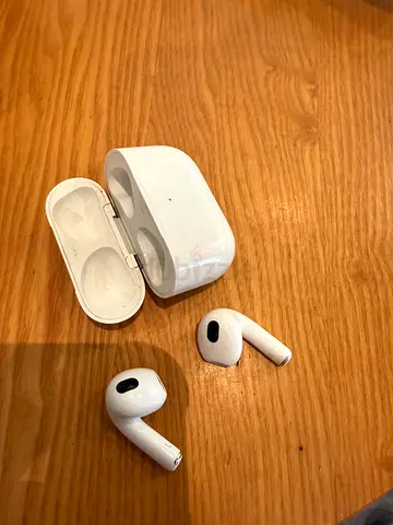Used wireless earbuds with charging case (AirPods 3) - good working condition