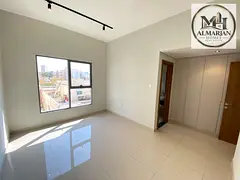 Two-bedroom apartment with a living room, three bathrooms, a balcony, and built-in wall closets; loc
