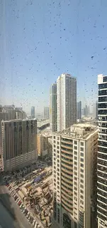 For rent: 2-bedroom apartment with a living room, located on the main Al Taawun Street. Features a f