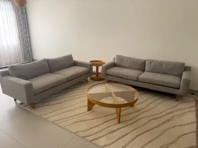 Pair of modern grey sofas with coffee and side tables - excellent condition