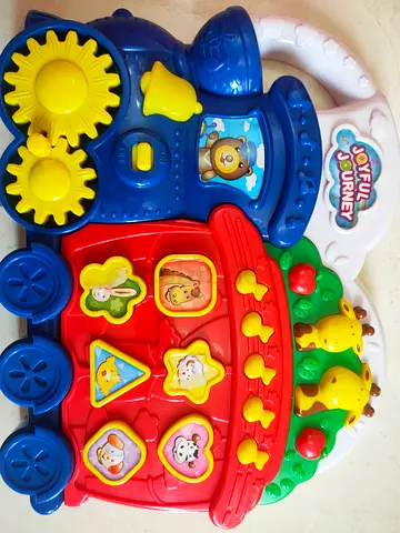 Used colorful musical activity toy panel — interactive buttons and gears