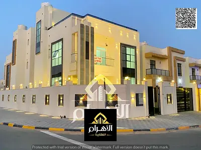 Villa for sale in Al Zahia, Ajman. Features 4 master bedrooms, a roof terrace, a majlis, a living a