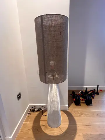 Tall floor lamp with linen shade and white ceramic base