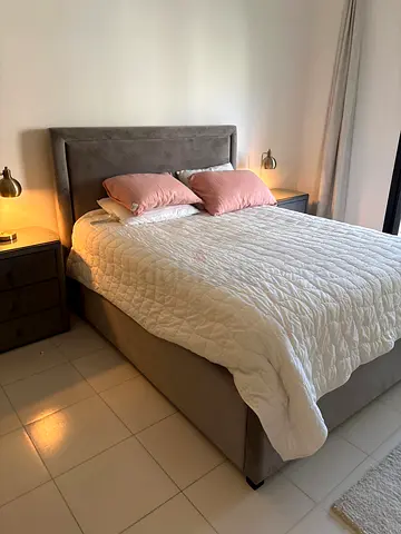 Grey upholstered double bed with headboard and storage base ( mattress from Galleria mall is free )
