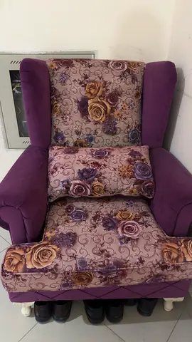 Single upholstered armchair with floral fabric — good condition