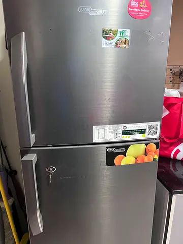 Silver Double-Door Refrigerator in Good Working Condition