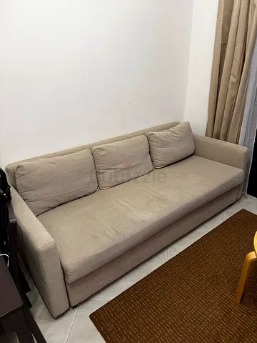 Beige 3-seater sofa bed from IKEA