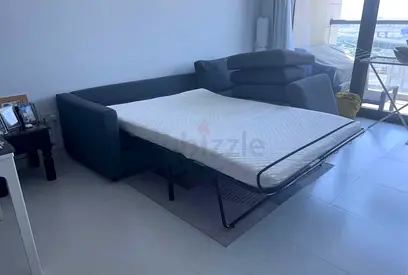 Grey fabric sofa bed with pull-out mattress  good condition