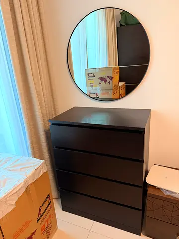 Dark wood 4-drawer dresser in good condition with wall mirror