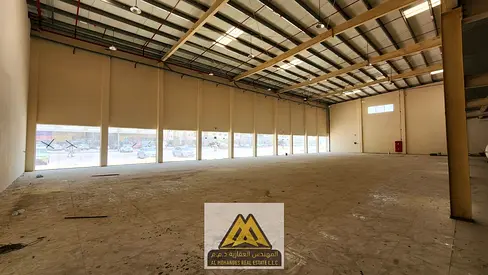Large showroom for annual rent | Al Jurf Industrial 3 | Mezzanine | Strategic location | Suitable f