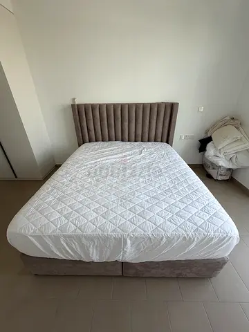 King bed with upholstered headboard and base - good condition