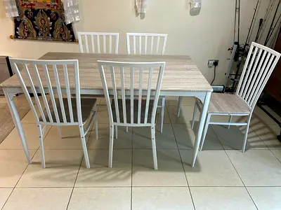 Wood-look dining table with 6 white metal chairs included - perfect condition
