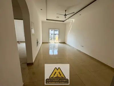 1BR with master bedroom in Al Yasmeen, Ajman. 2 baths, balcony, central AC. AED 33K/year, 4 or 6 payments, AED 1K cash deposit, AED 1,500 clearance fe