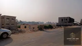 Residential-commercial land in Al Helio 1, measuring 280 square meters, priced at 660,000 AED—incl