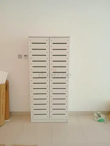 White Tall Storage Cabinet with Multiple Slim Drawers
