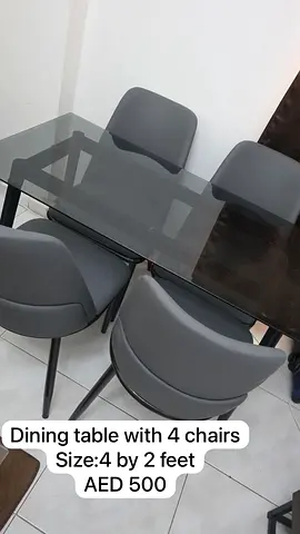 Dining table with glass top and 4 chairs